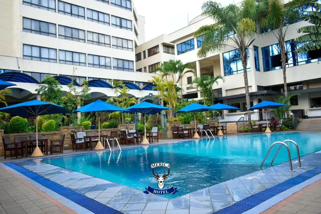 Swimming pool and terrace with blue umbrellas