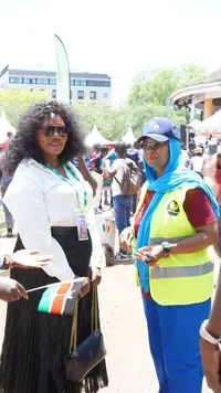 Guests with Kenyan flags at the event