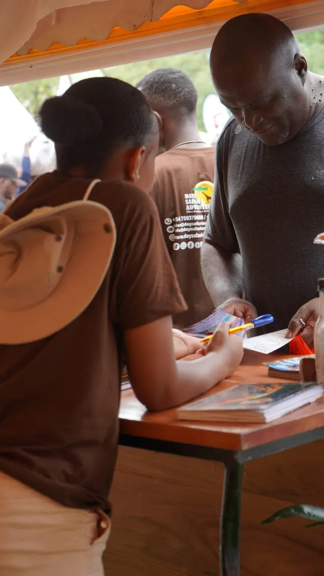 Team member handing out brochures