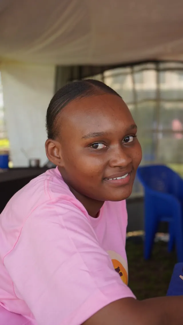 Smiling team member at the stand